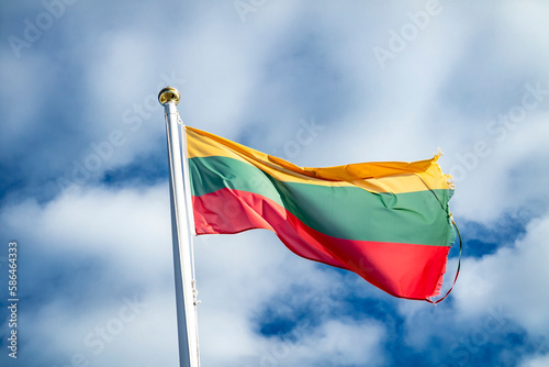 Lithuania flag waving in the wind. Clouds