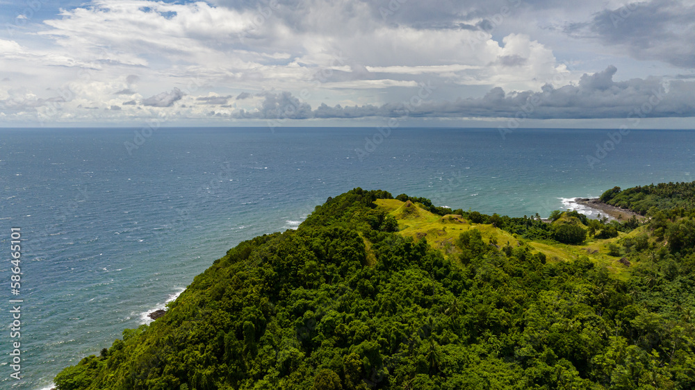 Coastline of Borneo island with beach and rainforest. Sabah, Malaysia.