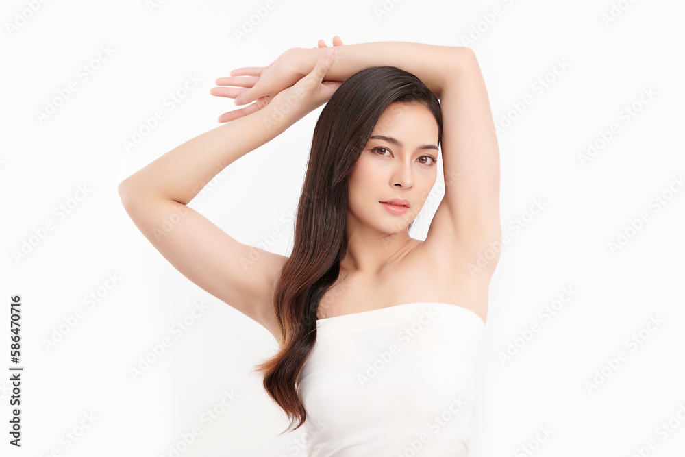 Beautiful Young Asian woman lifting hands up to show off clean and hygienic armpits or underarms on white background, Smooth armpit cleanliness and protection concept Beautiful Young Asian woman lifting hands up to show off clean and hygienic armpits or underarms on white background, Smooth armpit cleanliness and protection concept