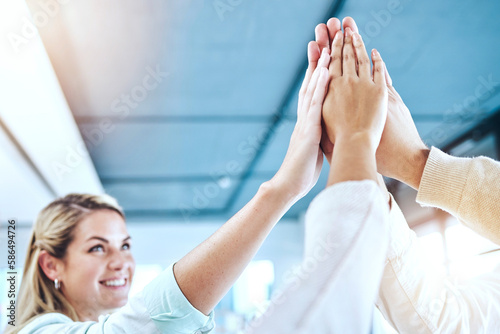 Business people, high five and team collaboration for agreement, community or trust in unity at office. Group touching hands together in teamwork for corporate goals, celebration or support at work