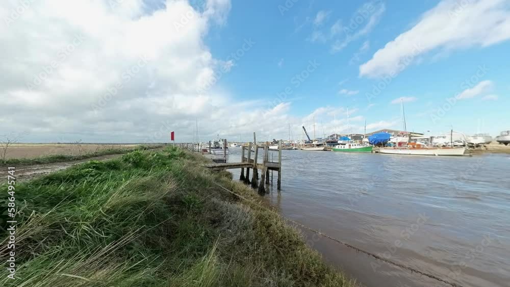 A lowdown view across the River Blyth and harbour in the village of Walberswick on the Suffolk coast. Captured in the springtime A lowdown view across the River Blyth and harbour in the village of Walberswick on the Suffolk coast. Captured in the springtime