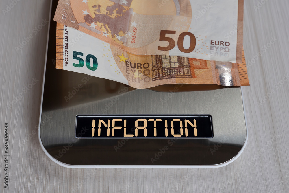 Obraz premium euro bills on electronic scales, a symbol of cost reduction, inflation, depreciation of money. concept of inflation in the European Union