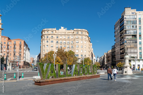 Cavalry Academy building in the center of Valladolid, In front is written the name of the city written decorated with grass an flowers. Plaza de Zorrilla Square
