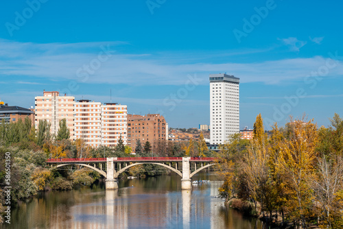 Valladolid city - Spain. View of River Pisuerga and Alfonso Suarez Bridge. Travel destination in Spain. Autumn landscape