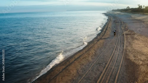 Wallpaper Mural Motocross running on the beach near the ocean at sunset Torontodigital.ca