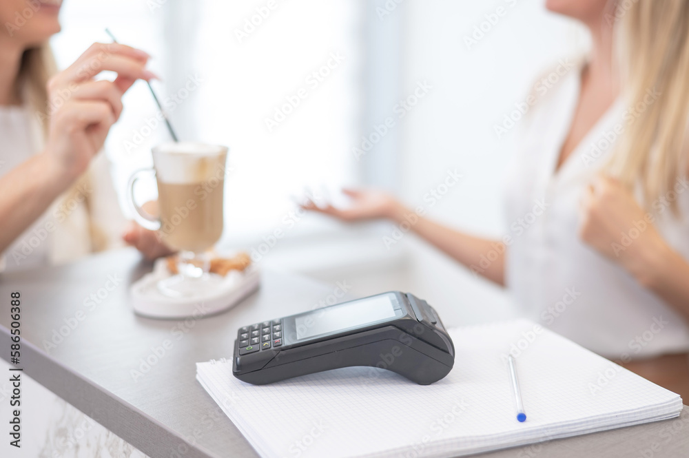 Close-up of a contactless payment terminal in a beauty salon. Close-up of a contactless payment terminal in a beauty salon.