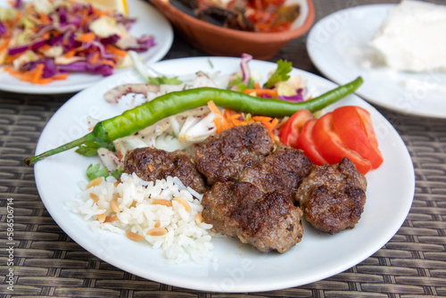 Delicious Turkish cuisine  Pergamon meatballs, Dry meatballs. Turkish name  Bergama kofte or kuru kofte © Esin Deniz