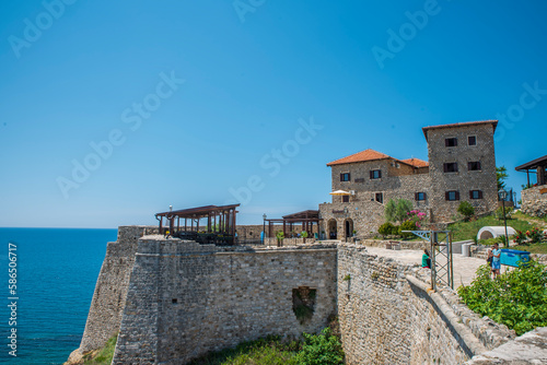 Ulcinj is also the southernmost port of Montenegro  a touristic and historical town located on the coast of the Adriatic Sea with old castle and stone made buildings with  blue sea and sky