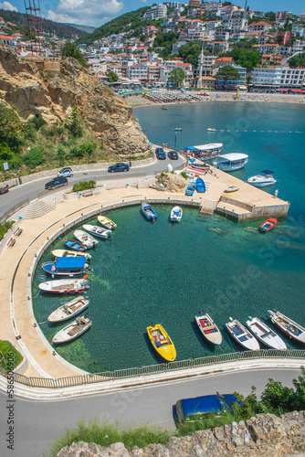 Ulcinj is also the southernmost port of Montenegro, a touristic and historical town located on the coast of the Adriatic Sea with old castle and stone made buildings with  blue sea and sky photo