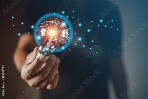 Hand holding Light bulbs with polygon abstract brain inside, business learning inspiration creativity. innovation and creative concept. information brainstorming genius.