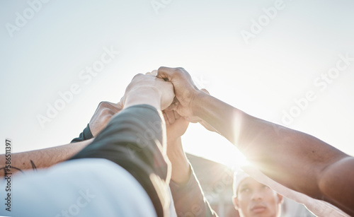 Hands up, motivation or sports men in huddle with support, hope or faith on baseball field in game together. Teamwork, fist or group of young softball athletes with goals, mission or solidarity