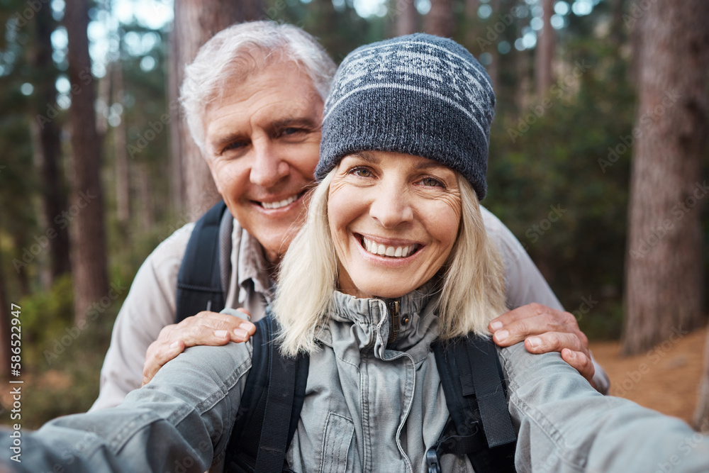 Fototapeta premium Senior couple, selfie and portrait, hiking in forest and happy people in nature and memory for social media post. Smile in picture, adventure and fitness outdoor, man and woman with active lifestyle