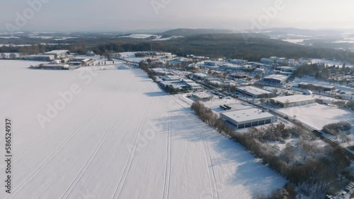 Aerial flight over Bischofswerda at a sunny winter day. Drone move forward photo