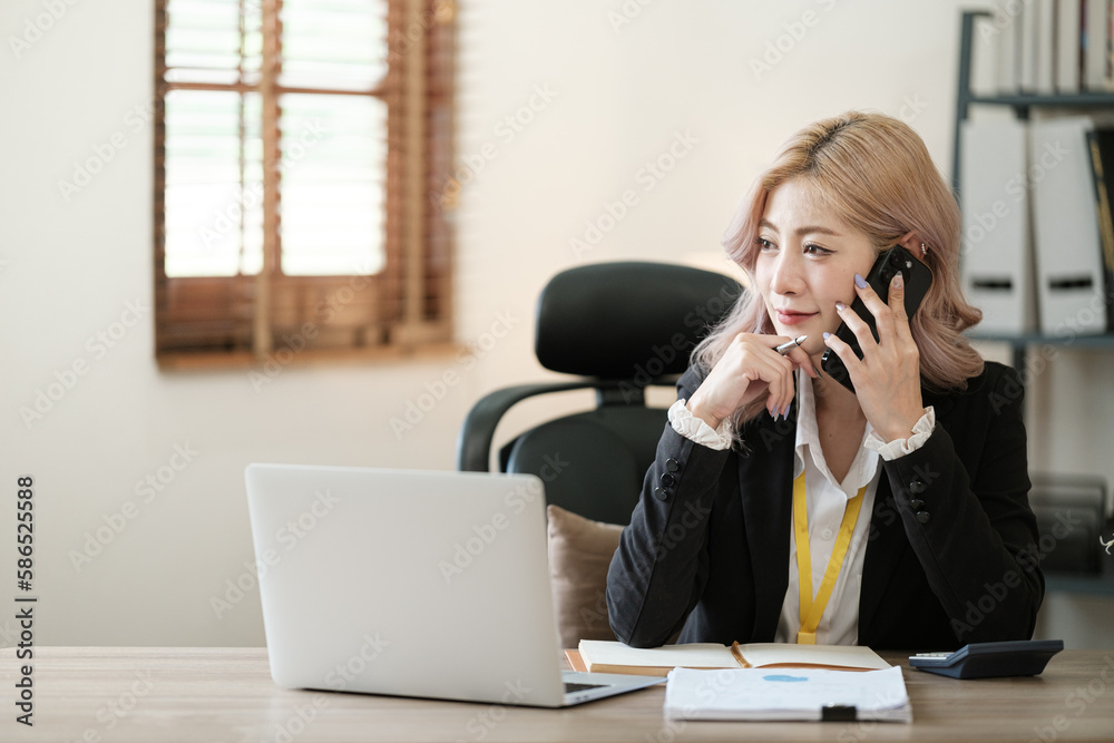 Close up on laptop in office, Asian happy beautiful businesswoman in formal suit work in workplace. Attractive female employee office worker smile. Close up on laptop in office, Asian happy beautiful businesswoman in formal suit work in workplace. Attractive female employee office worker smile.
