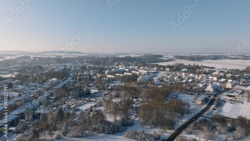 Aerial flight over Bischofswerda at a sunny winter day. Drone move forward photo