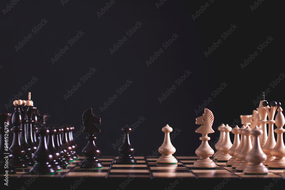 Chess figures on a black background Chess figures on a black background