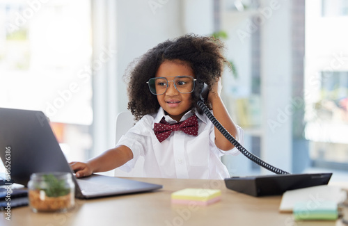 Little girl, telephone and laptop in call center working or playing pretend as a sales consultant at office. Happy kid on phone call talking at consulting desk for imagination, dream job or career