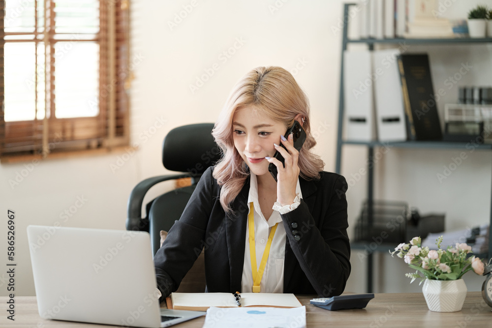 Close up on laptop in office, Asian happy beautiful businesswoman in formal suit work in workplace. Attractive female employee office worker smile. Close up on laptop in office, Asian happy beautiful businesswoman in formal suit work in workplace. Attractive female employee office worker smile.