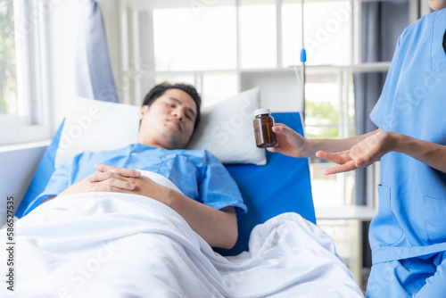 Nurse and male patient in hospital.