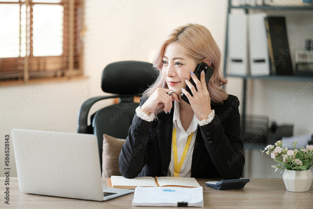 Close up on laptop in office, Asian happy beautiful businesswoman in formal suit work in workplace. Attractive female employee office worker smile. Close up on laptop in office, Asian happy beautiful businesswoman in formal suit work in workplace. Attractive female employee office worker smile.