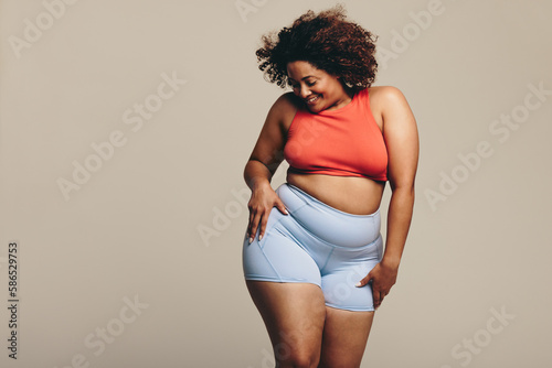 Photography Woman celebrating her body positivity through dance in a studio