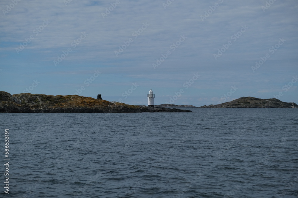 Fototapeta premium Small lighthouse on a rocky island in Sweden