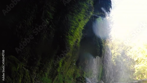 Water flowing under the waterfall. 