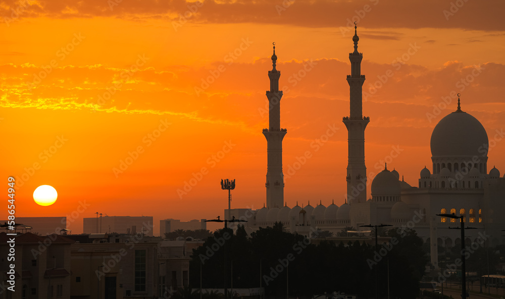 Amazing sunrise photo with Sheikh Zayed Grand Mosque landmark in Abu Dhabi. Sunrise landscape image with this iconic mosque from United Arab Emirates.