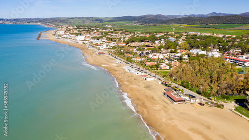 Aerial view of Santa Severa, a fraction of Santa Marinella, in the Metropolitan City of Rome, Italy. It is a small seaside town built along the coast. There are many small villas. © Stefano Tammaro