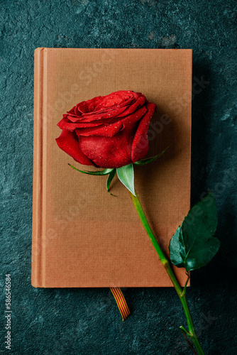 book, red rose and the Catalan flag photo