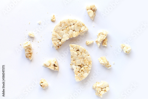 Broken puffed rice cracker isolated on white background