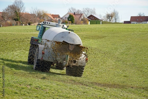 Agricultural machine in the farm watering and fertilizing the land with liquid animal manure.