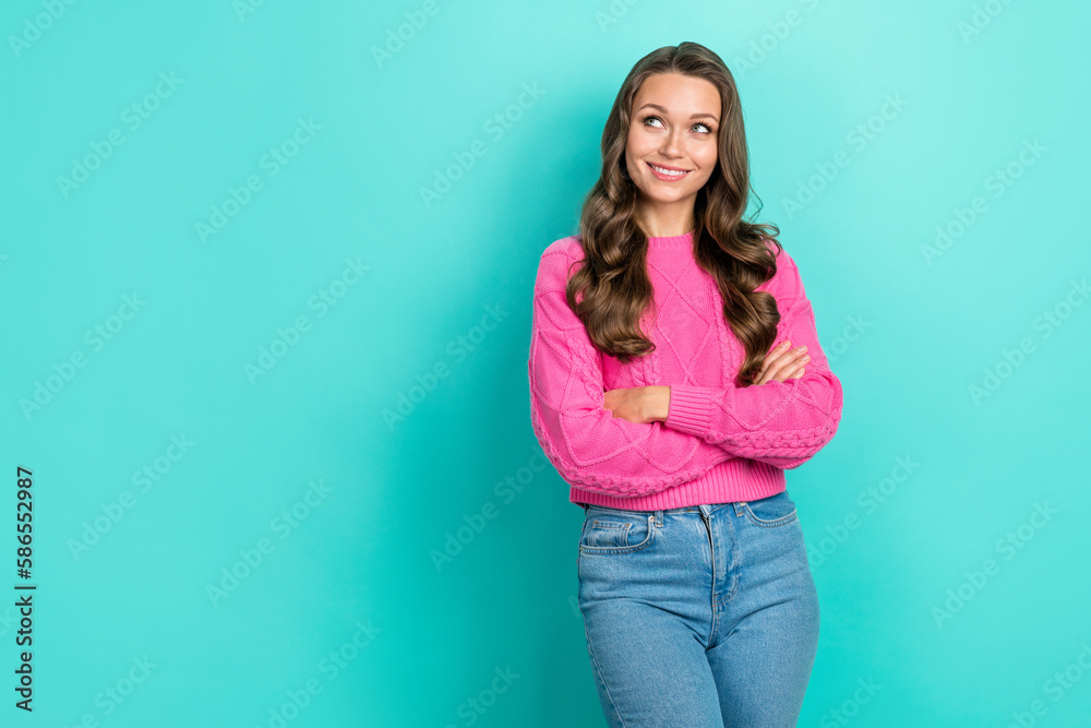 Photo of nice woman with wavy hairdo dressed knitwear sweater arms folded look at offer empty space isolated on teal color background Photo of nice woman with wavy hairdo dressed knitwear sweater arms folded look at offer empty space isolated on teal color background