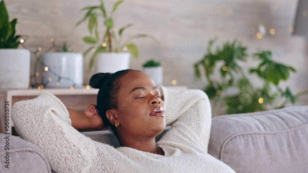 Black woman, relax and living room sofa rest with a female feeling tired in a home. Calm, resting and African person ready for a nap on a lounge couch in a house with peace and sleep in household