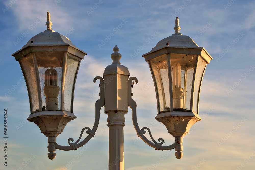 Couple lanterns in a park with evening sunlight shining through