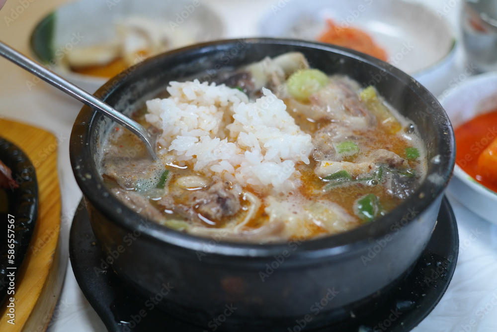 It is a Korean dish consisting of pork intestines stuffed with seasoning and minced vegetables, and rice soup.