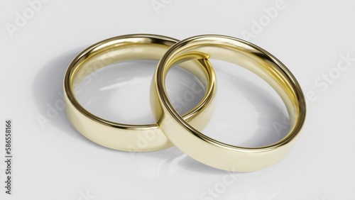 Two golden wedding rings on the black background