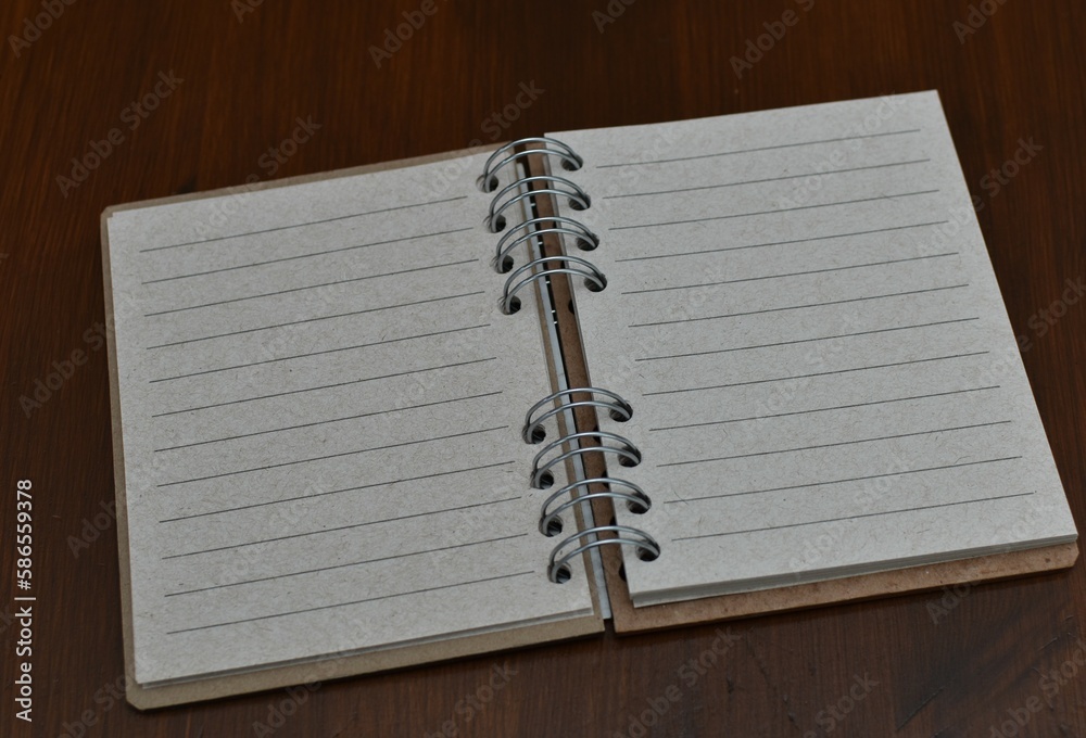 lined notebook on a wooden table lined notebook on a wooden table