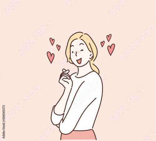 Woman making heart shape with two fingers. Hand drawn style vector design illustrations.