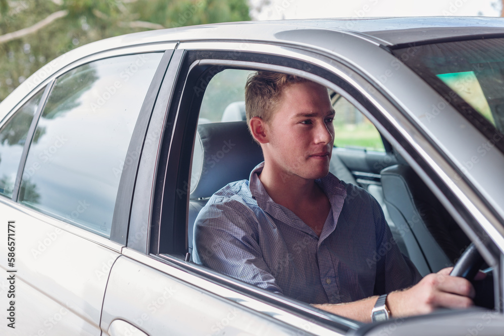 young man in a car young man in a car