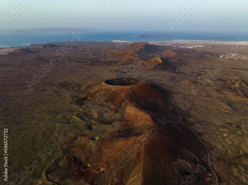 Obraz na płótnie View from above, stunning aerial view of Calderon Hondo during a beautiful sunrise. Calderon Hondo is a volcanic caldera in the sland of Fuerteventura, Canary Islands. w salonie