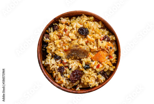 Rice pilaf with lamb meat and vegetables in a wooden bowl.   Isolated, transparent background.