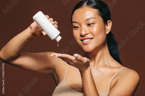 Female skincare routine with facial serum treatment