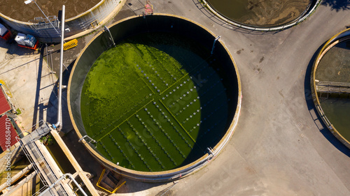 Aerial view of the tanks of a sewage and water treatment plant enabling the discharge and re-use of waste water. It's a sustainable water recycling with treatment plant.  © Stefano Tammaro