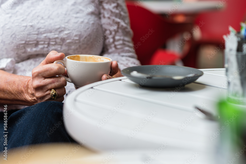 older woman with coffee cup older woman with coffee cup