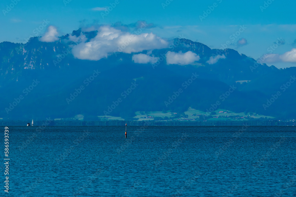 beautiful view of the lake chiemsee with the alps in background 