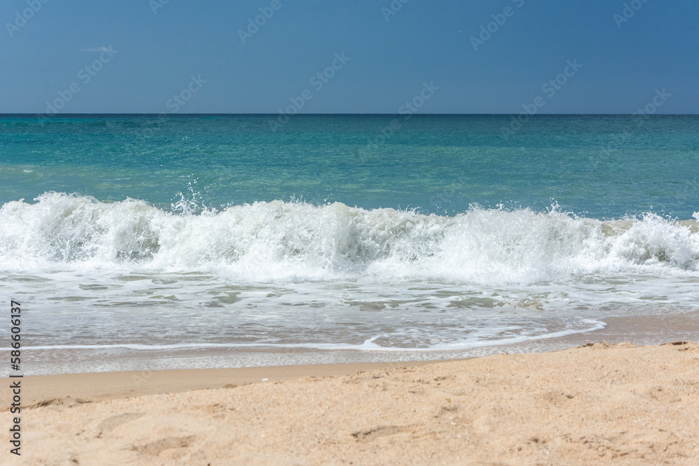 Waves crashing on the seashore. Blue sea. Foamy waves. waves for surfing tropical beach

