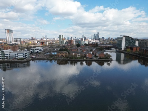 Aerial  of Salford Quays with views towards Manchester city centre and modern skyscrapers. 