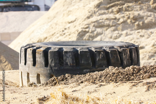 Tires for large trucks dumped in sandy soil