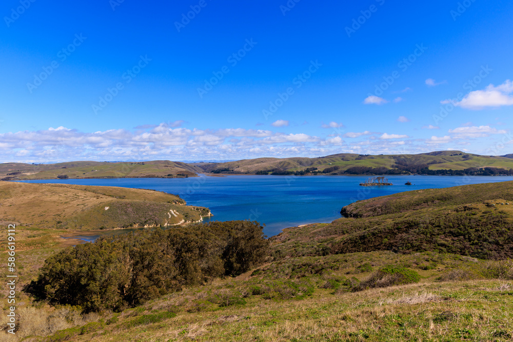 Small blue bay in dry green hills of coastal California on sunny day Small blue bay in dry green hills of coastal California on sunny day
